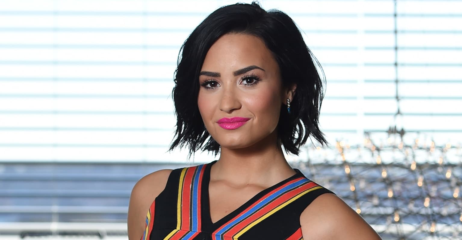Demi Lovato faces backlash for 'cuddling' turkeys before roasting a bird for Thanksgiving
