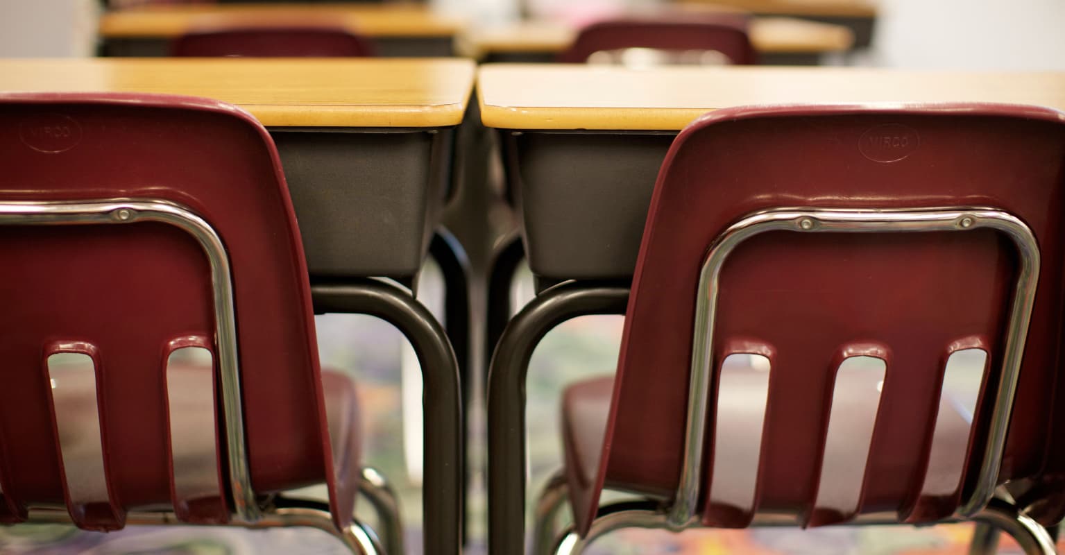 Teacher reveals why he's kept an empty chair in his classroom for 50 years
