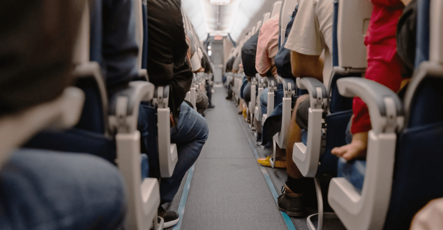 Man divides social media after standing on flight 'for 6 hours' so his wife could lie across the seats