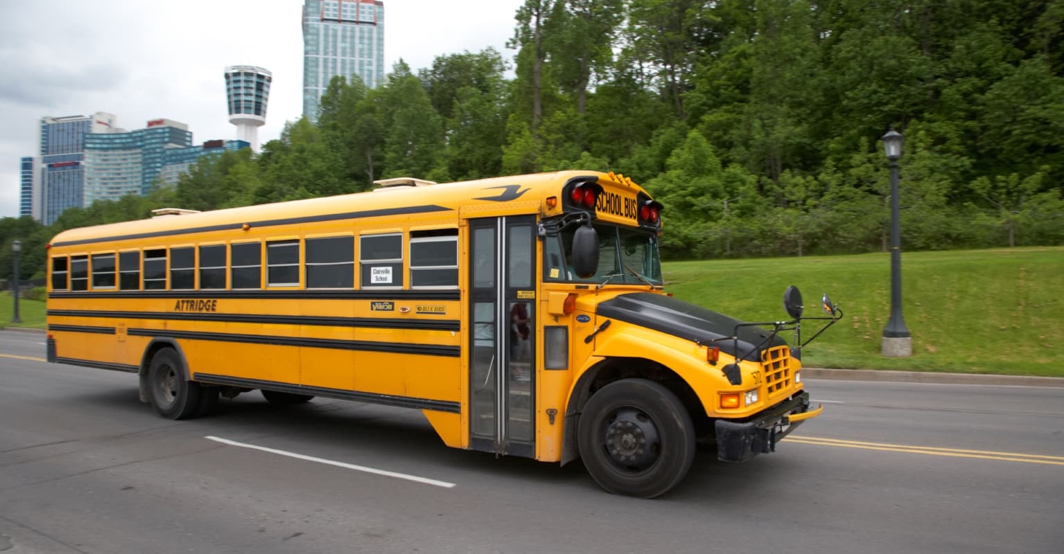 Screaming children climb out of school bus windows after driver speeds away after altercation with parent