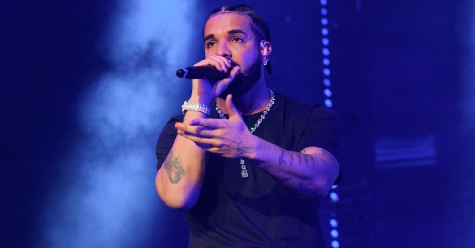 Over-eager fan grabs Drake by the throat as rapper walks through crowd