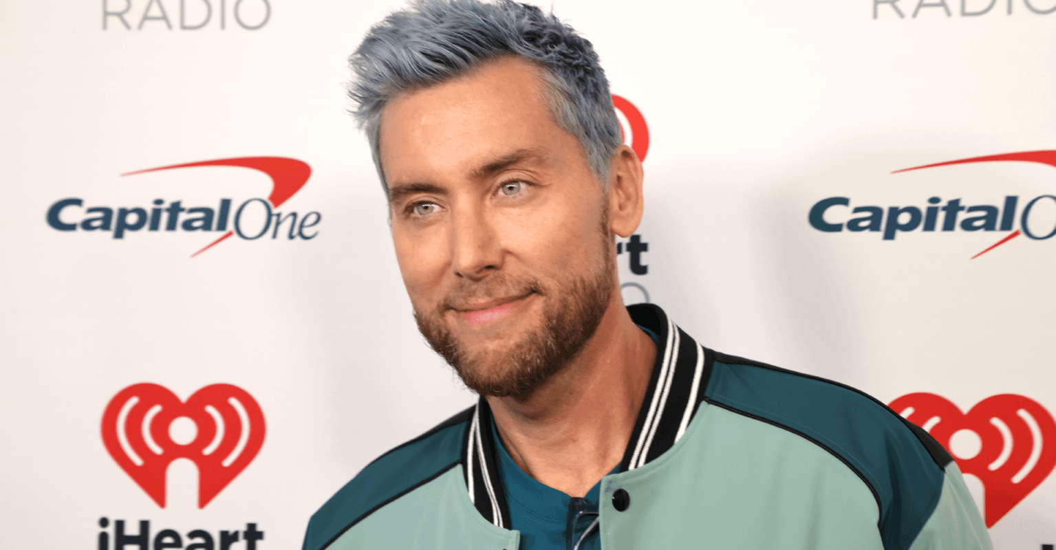 NSYNC's Lance Bass trolls the NFL with 'not Taylor Swift' sign during game