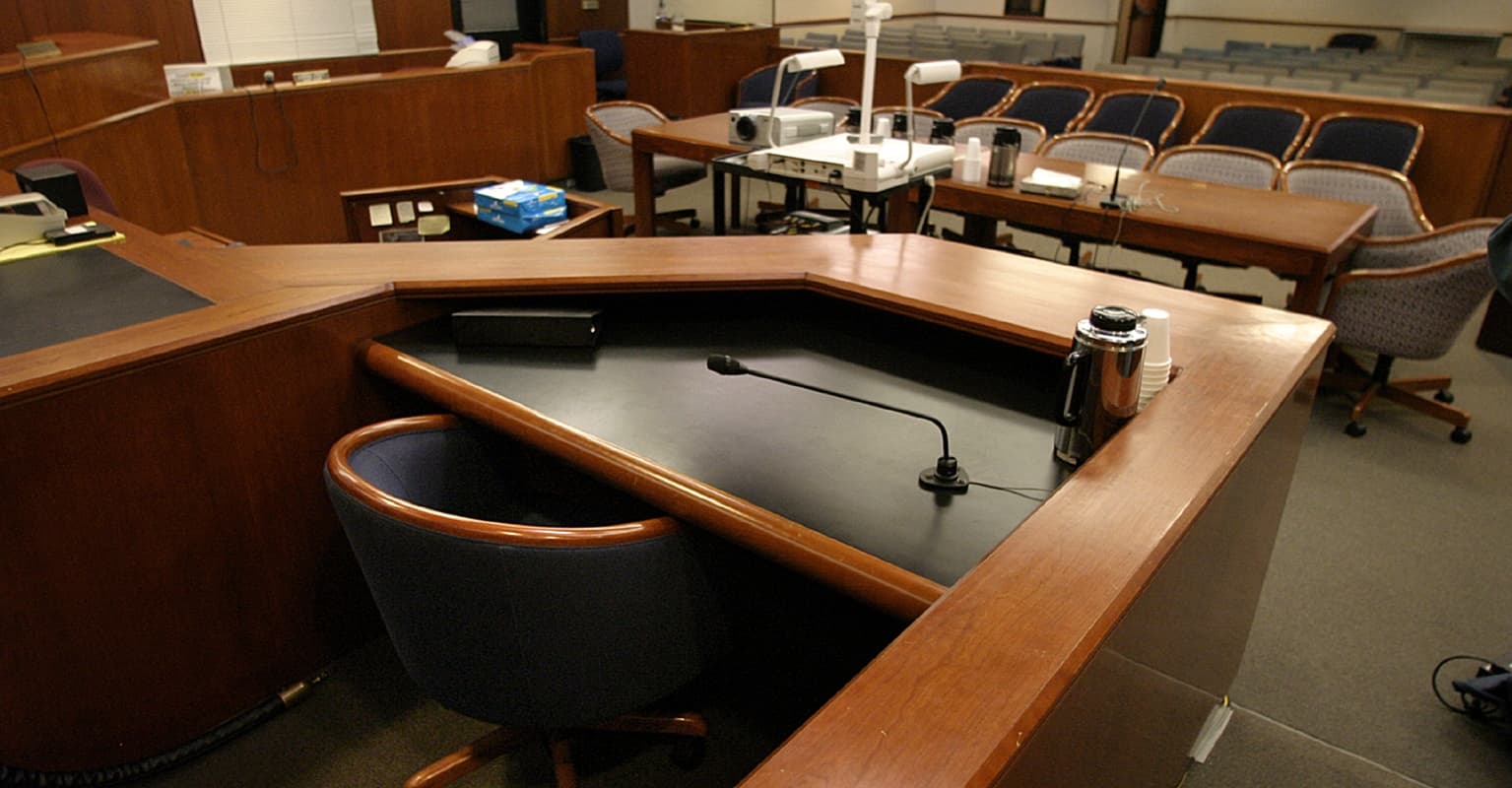 Woman throws up on stand as she's shown photos of disabled son she starved to death